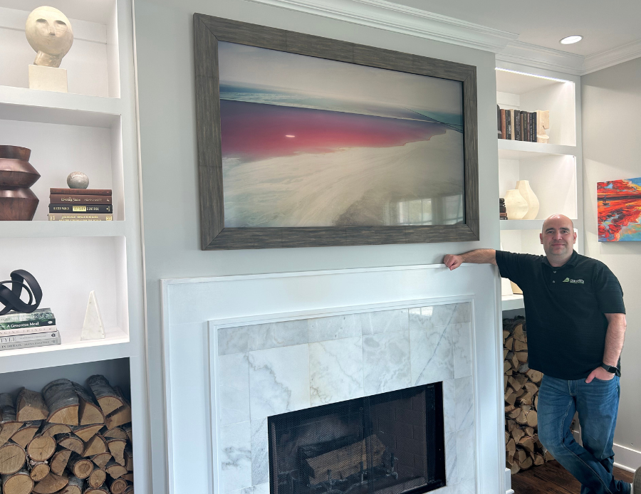 Rob at Barrett’s Technology Solutions’ Lake Geneva Design Center, featuring a TV disguised as artwork.