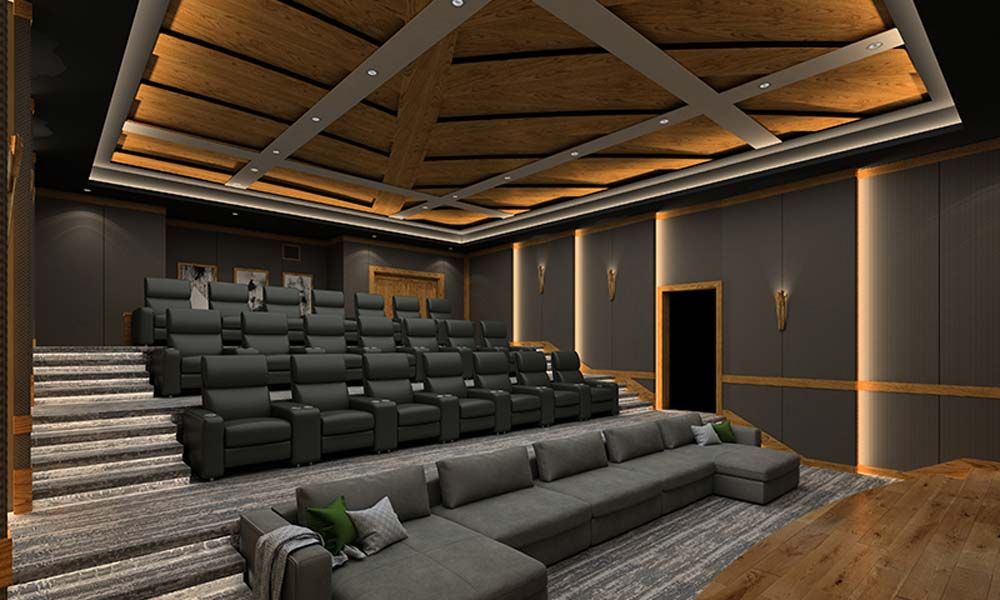 Cinematech room with black couches in it