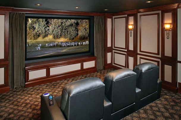 home theater with large screen and red wooden accents