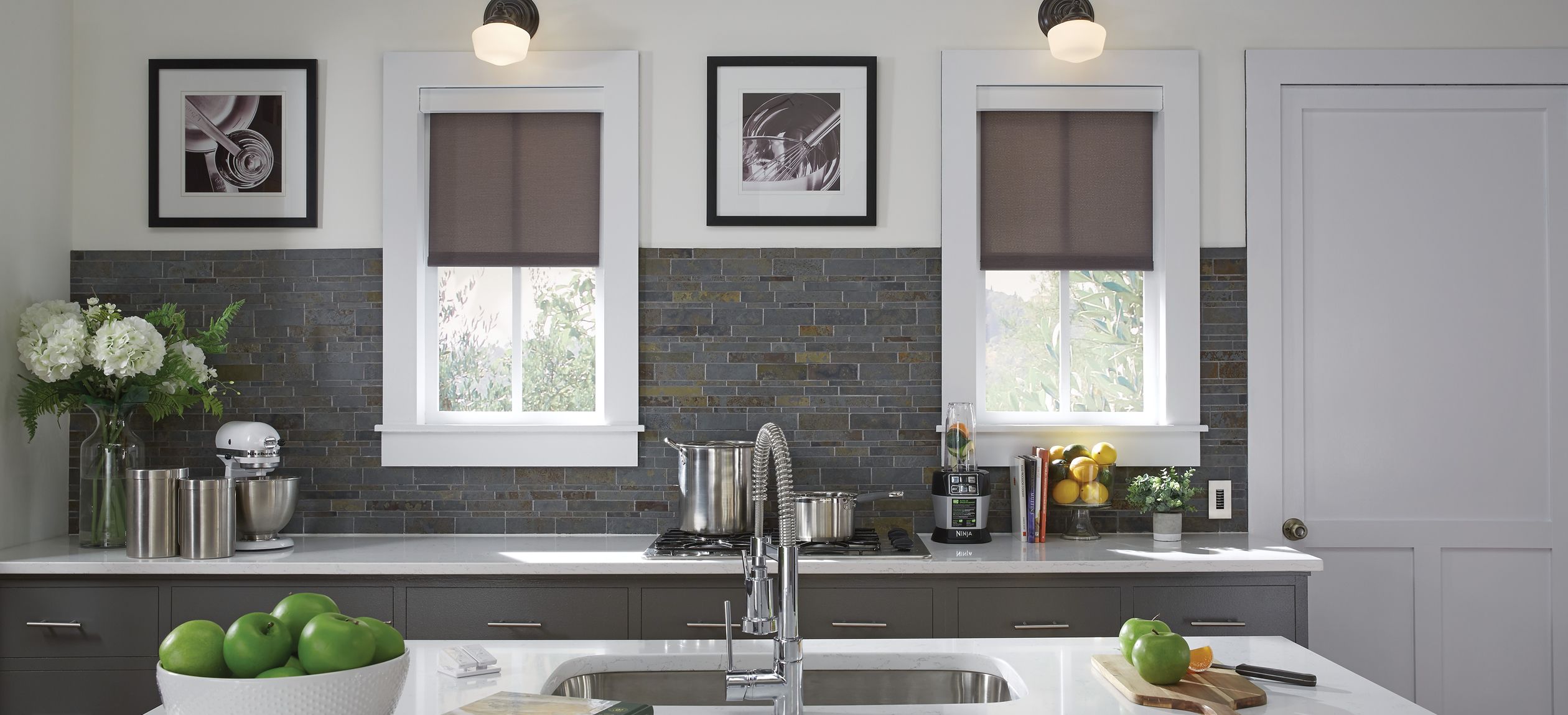 Grey and White kitchen image with window treatments from Lutron