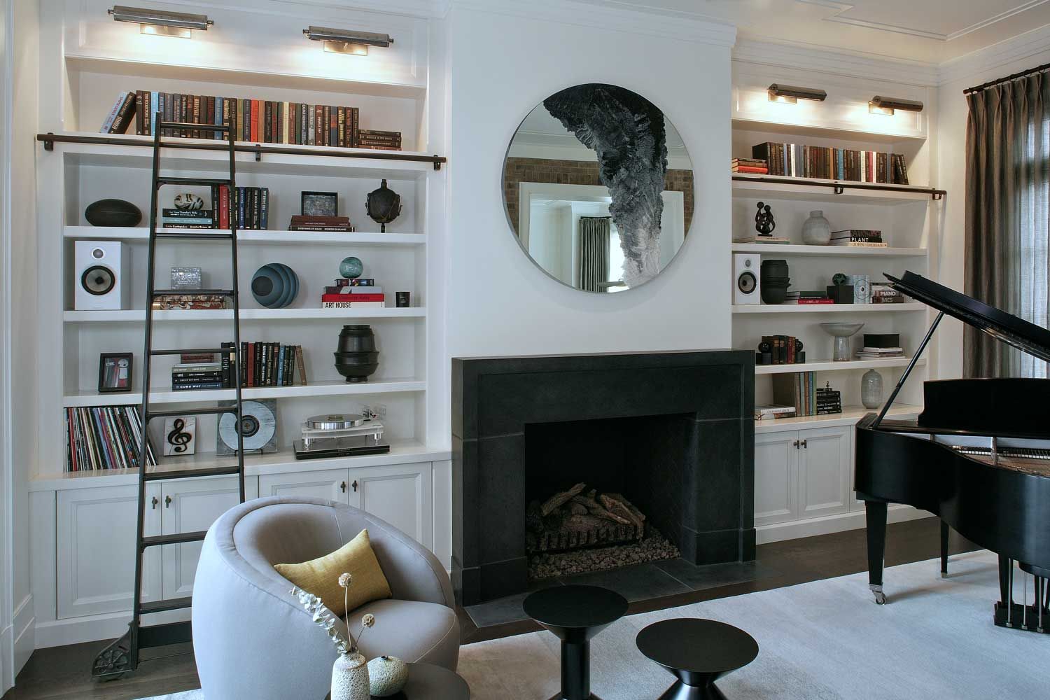 white walls in listening room with black fireplace