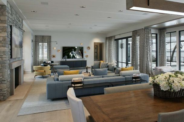 Family room with grey and yellow furniture, wide bright and open