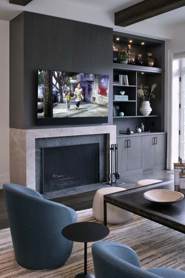 Living area with TV on wall and dark accents