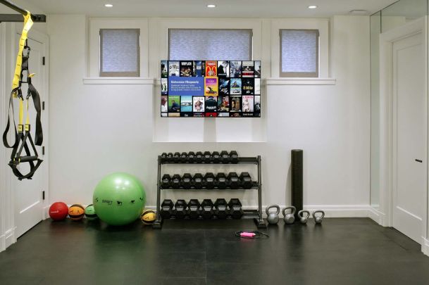 Home gym with tv and exersize equipment
