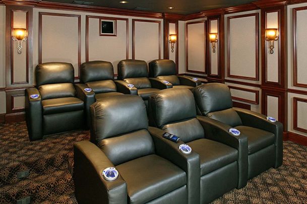 Home theater seating with wooden accents on walls